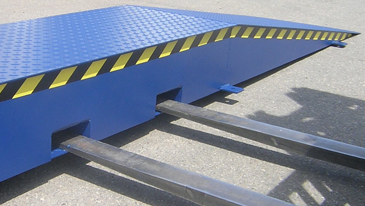 Steel wheel risers with forklift pockets
