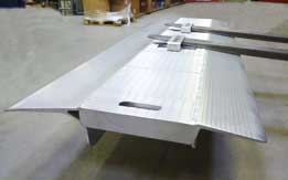 Alluminium loading dock board with forklift pockets