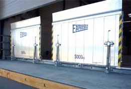 Sliding drawbridge leveler on rail