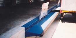Sliding drawbridge leveler on rail