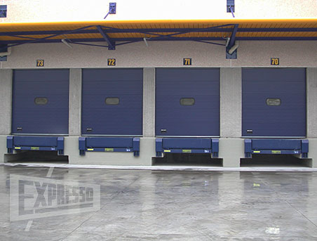 Swing lip dock leveler