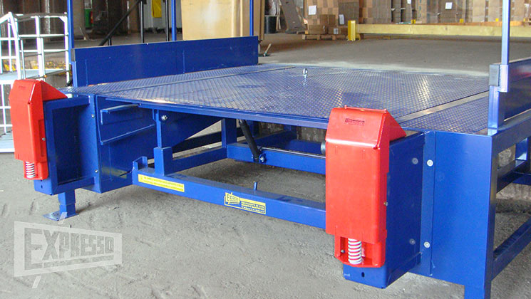 Dock leveler on external frame with refuge area